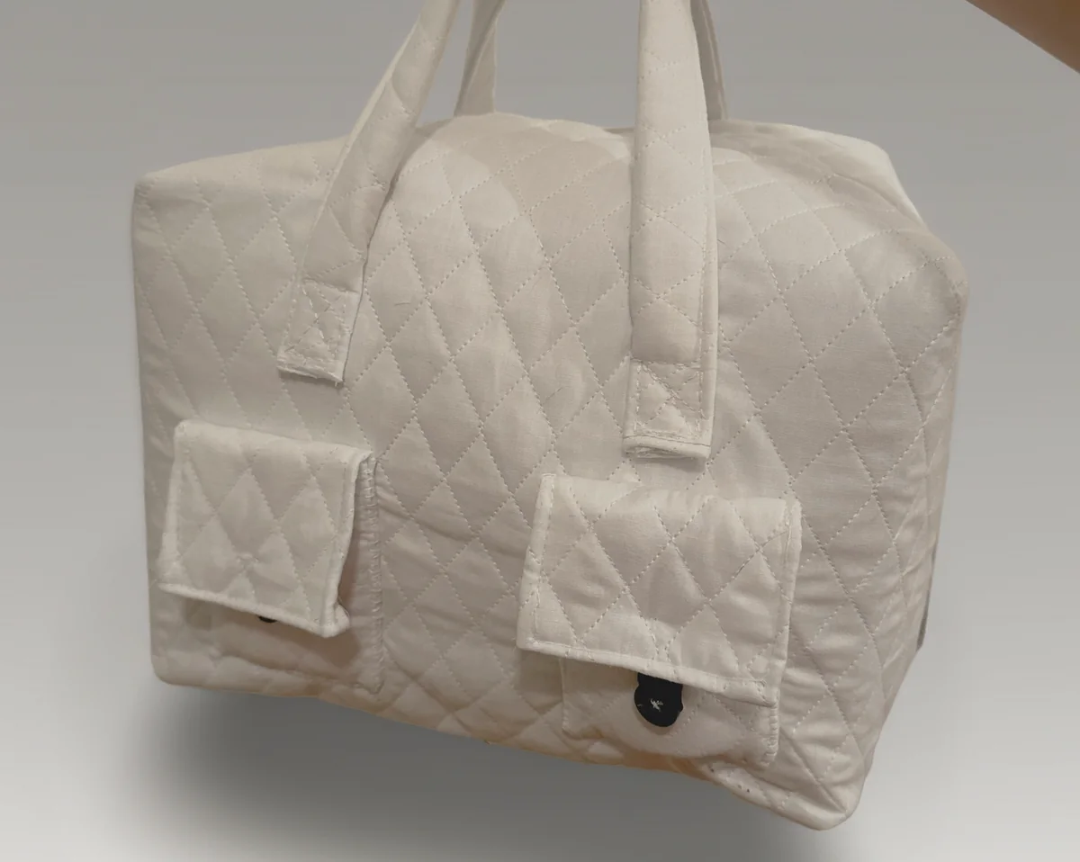 Quilted cream organizing bag with two front pockets